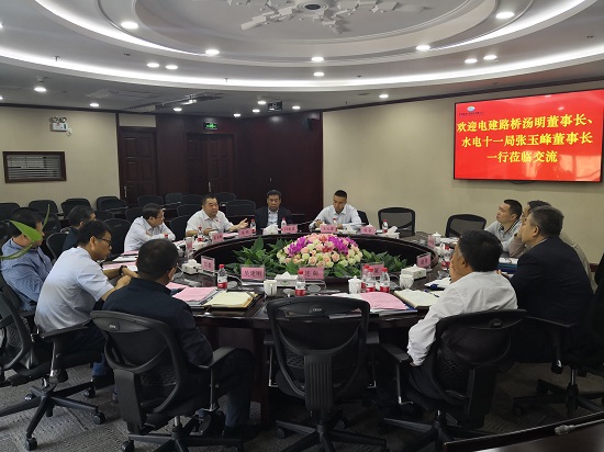 汤明拜会深圳高速公路股份有限企业董事长胡伟